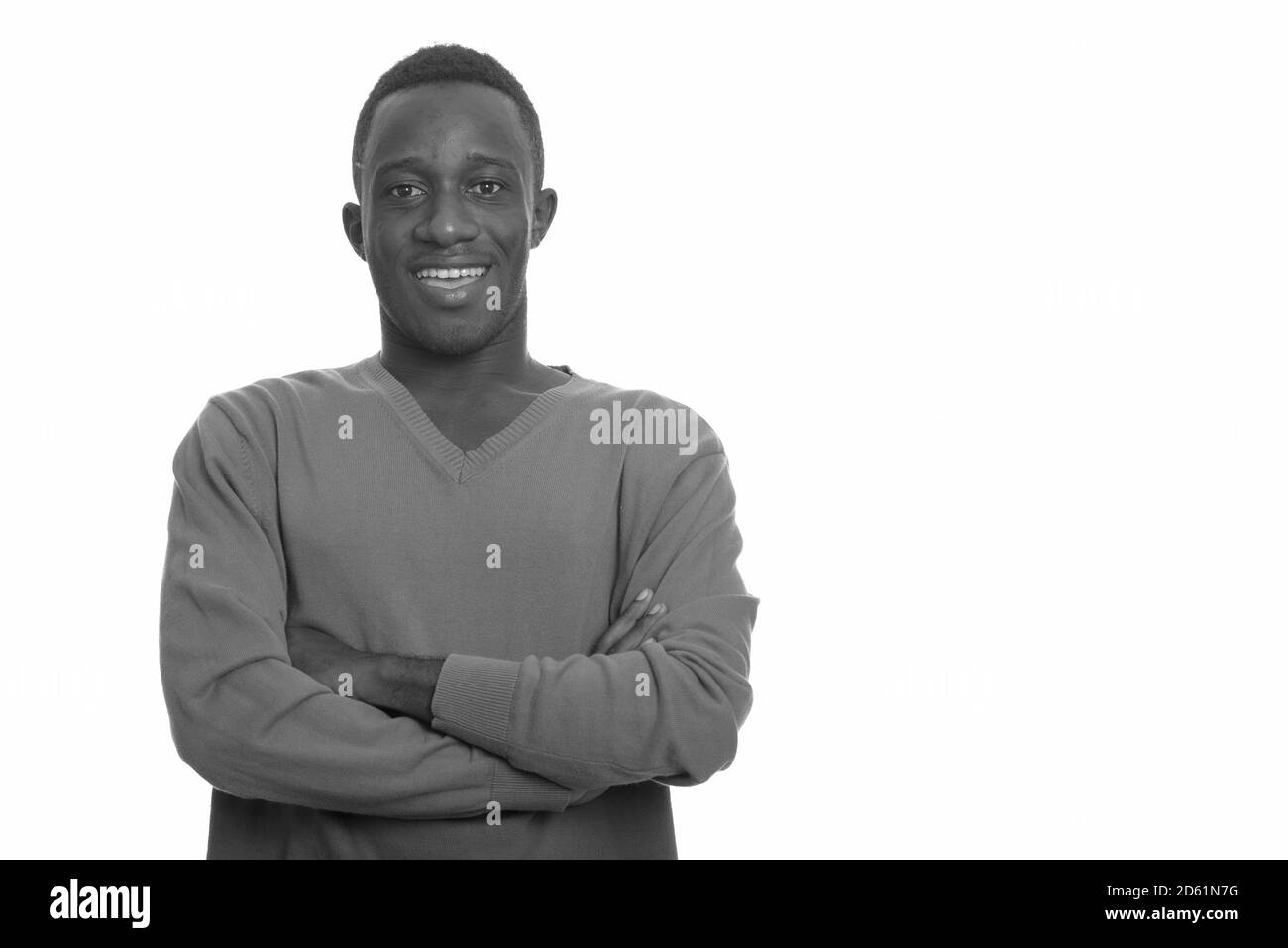 Young happy African man smiling with arms crossed Stock Photo - Alamy
