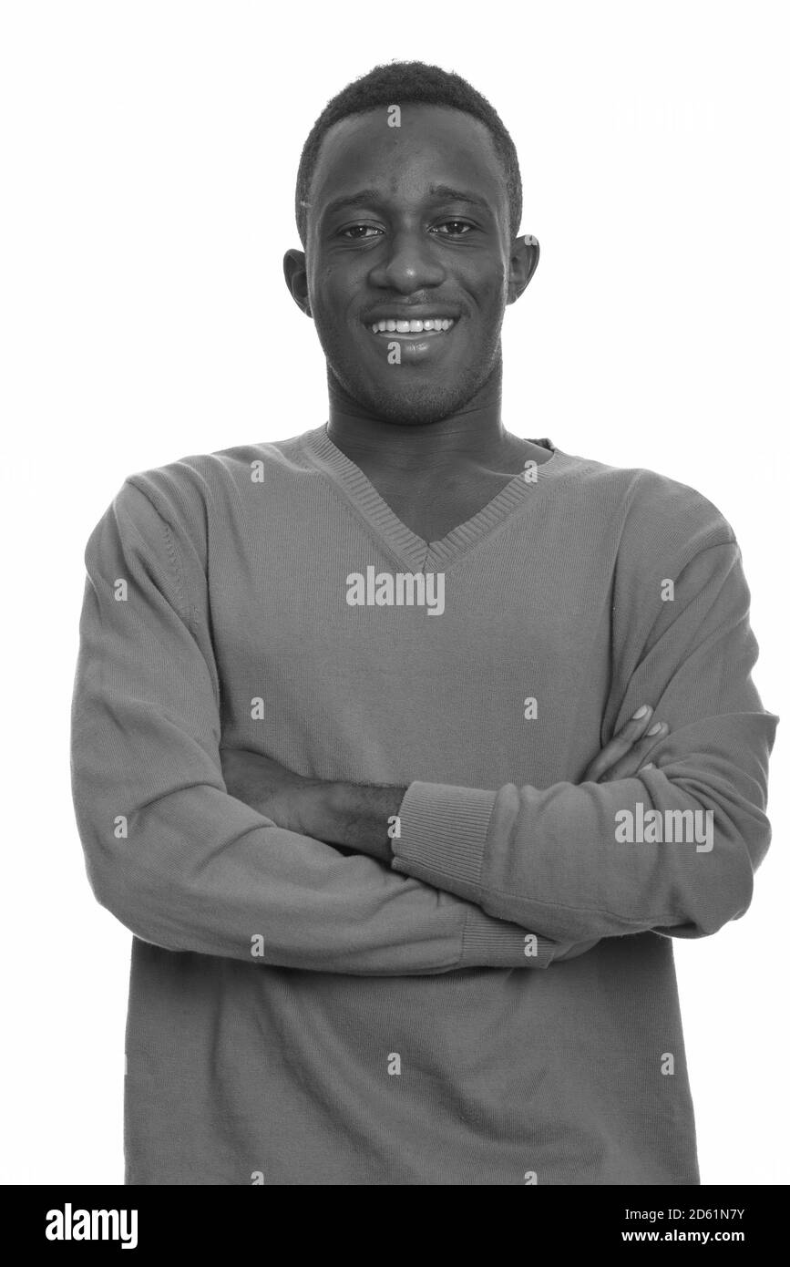 Young happy African man smiling with arms crossed Stock Photo - Alamy