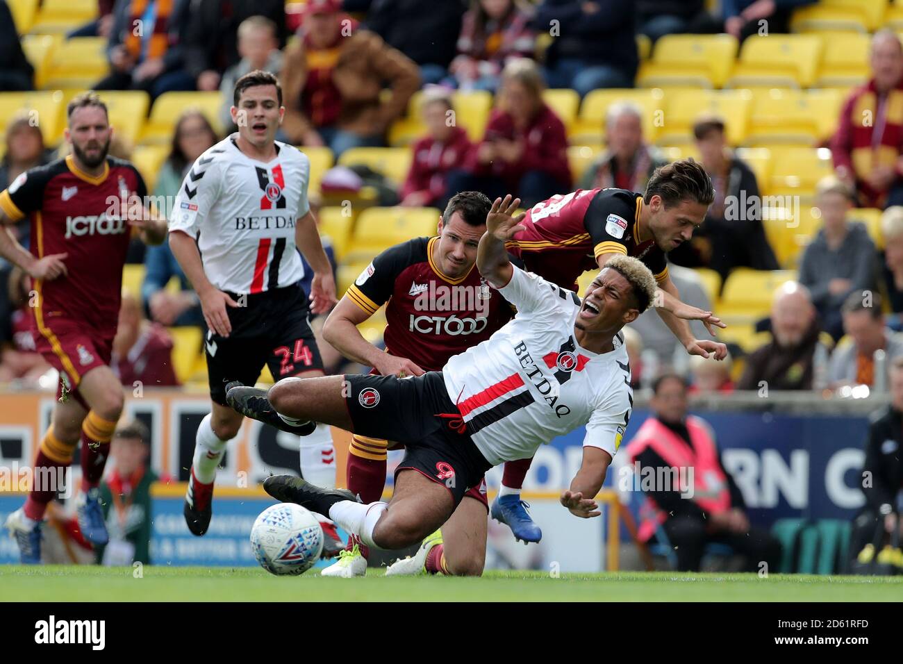 Charlton Athletic's Lyle Taylor (bottom, centre) is tackled by Bradford City's Ryan McGowan Stock Photo