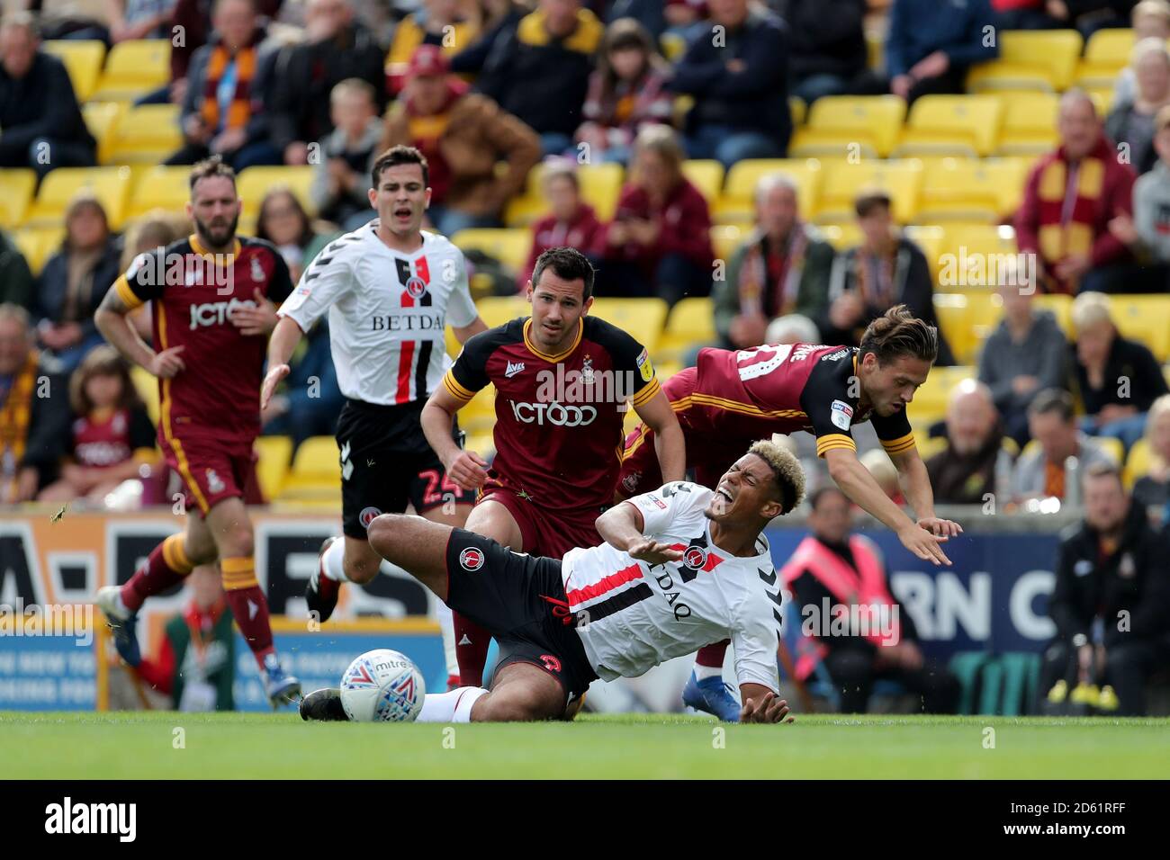 Charlton Athletic's Lyle Taylor (bottom, centre) is tackled by Bradford City's Ryan McGowan Stock Photo