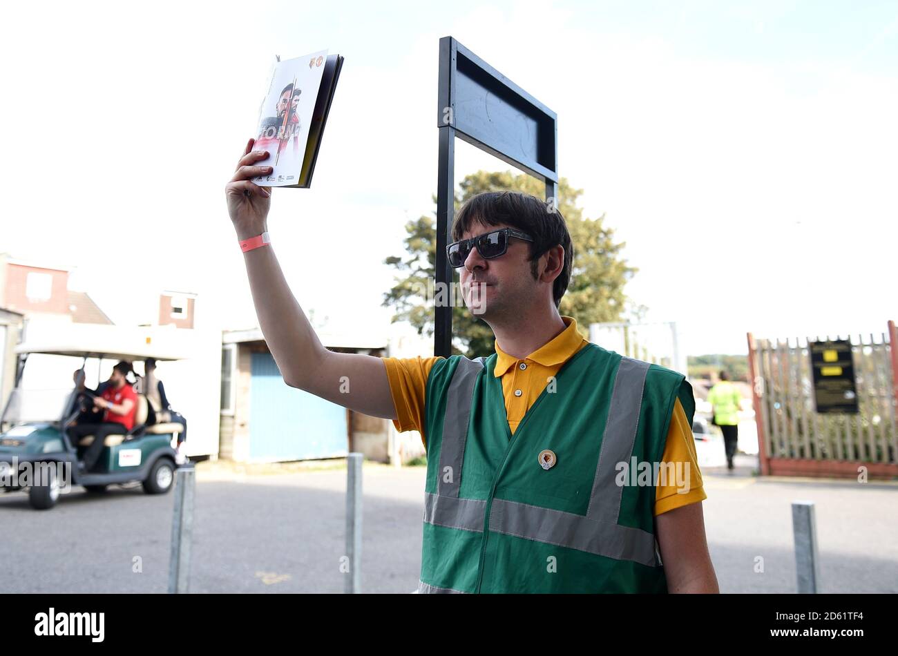 A vendor sells match day programmes Stock Photo - Alamy