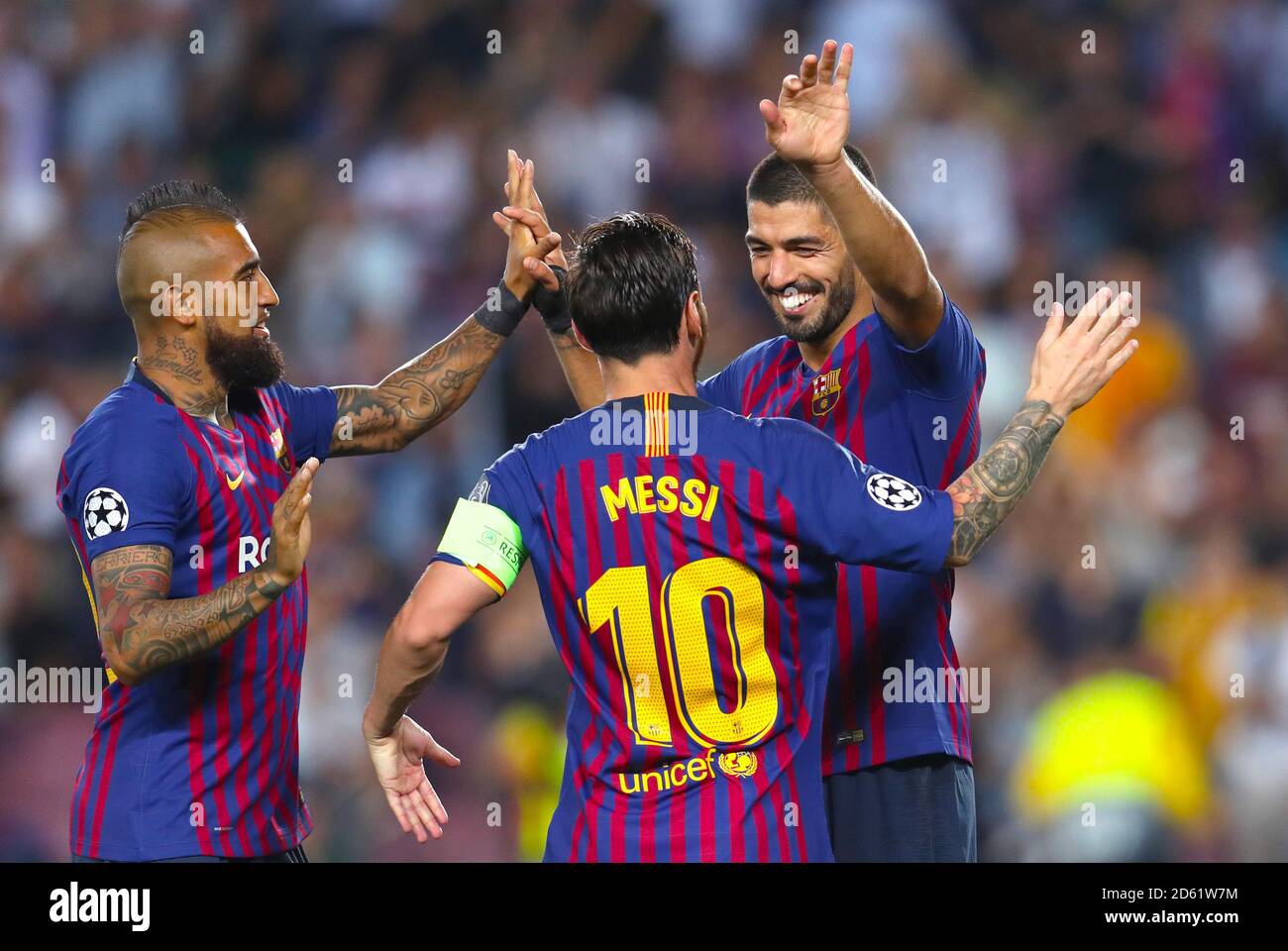 Barcelona's Lionel Messi (centre) celebrates scoring with team mates