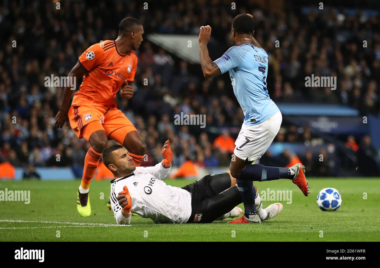Manchester City's Sergio Aguero (right) collides with Lyon goalkeeper Anthony Lopes Stock Photo