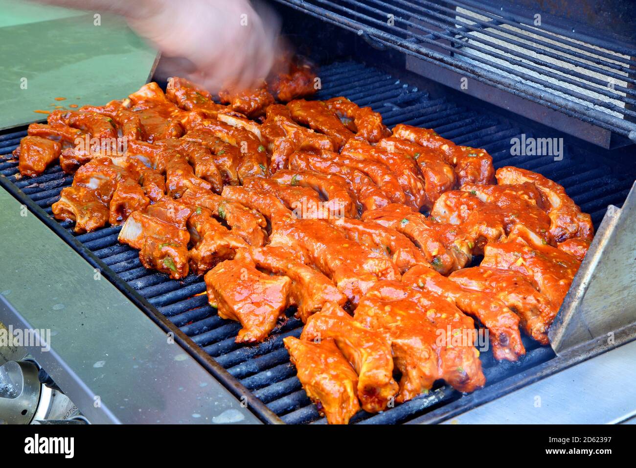 BBQ Pork Ribs Cooking on Grill Stock Photo
