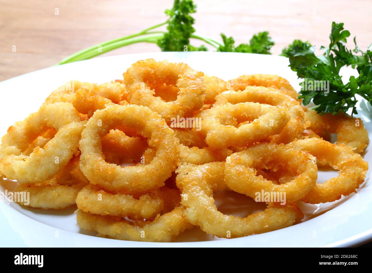 Crispy Calamari Rings on a White Plate Stock Photo Alamy