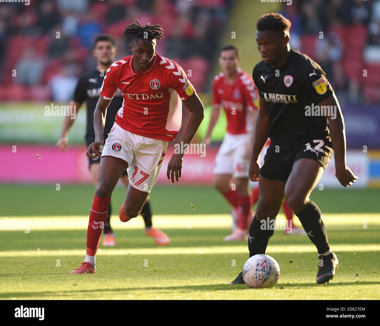 Charlton Athletic's Joe Aribo (left) in action with Barnsley's Dimitri Cavare Stock Photo