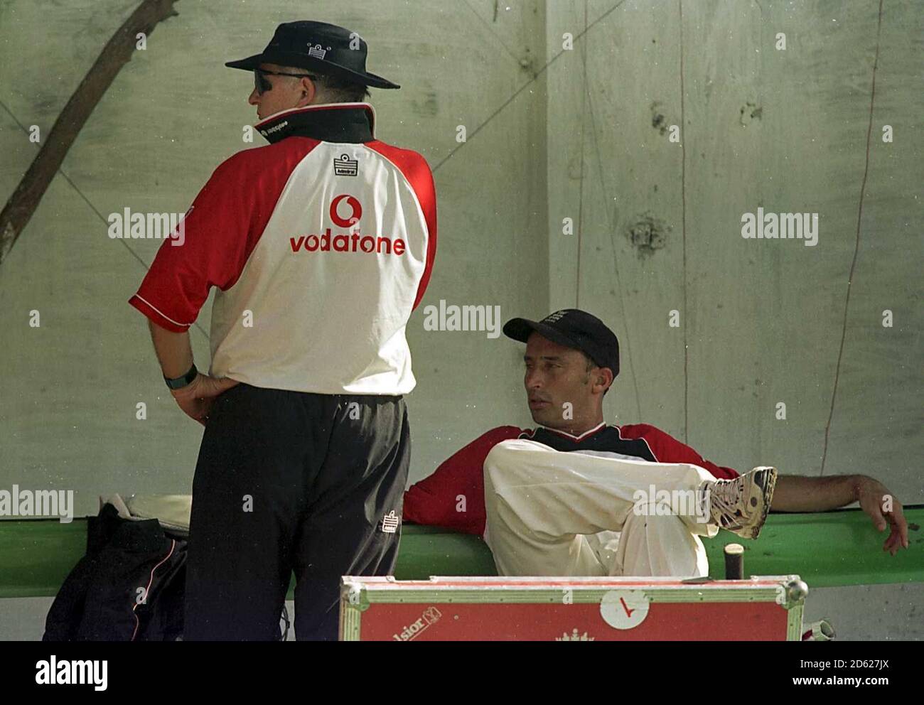 England's Nasser Hussain talks tactics with England Coach Duncan Fletcher as they wait to face Pakistan at The National Stadium in Karachi for the final test of the series. Stock Photo