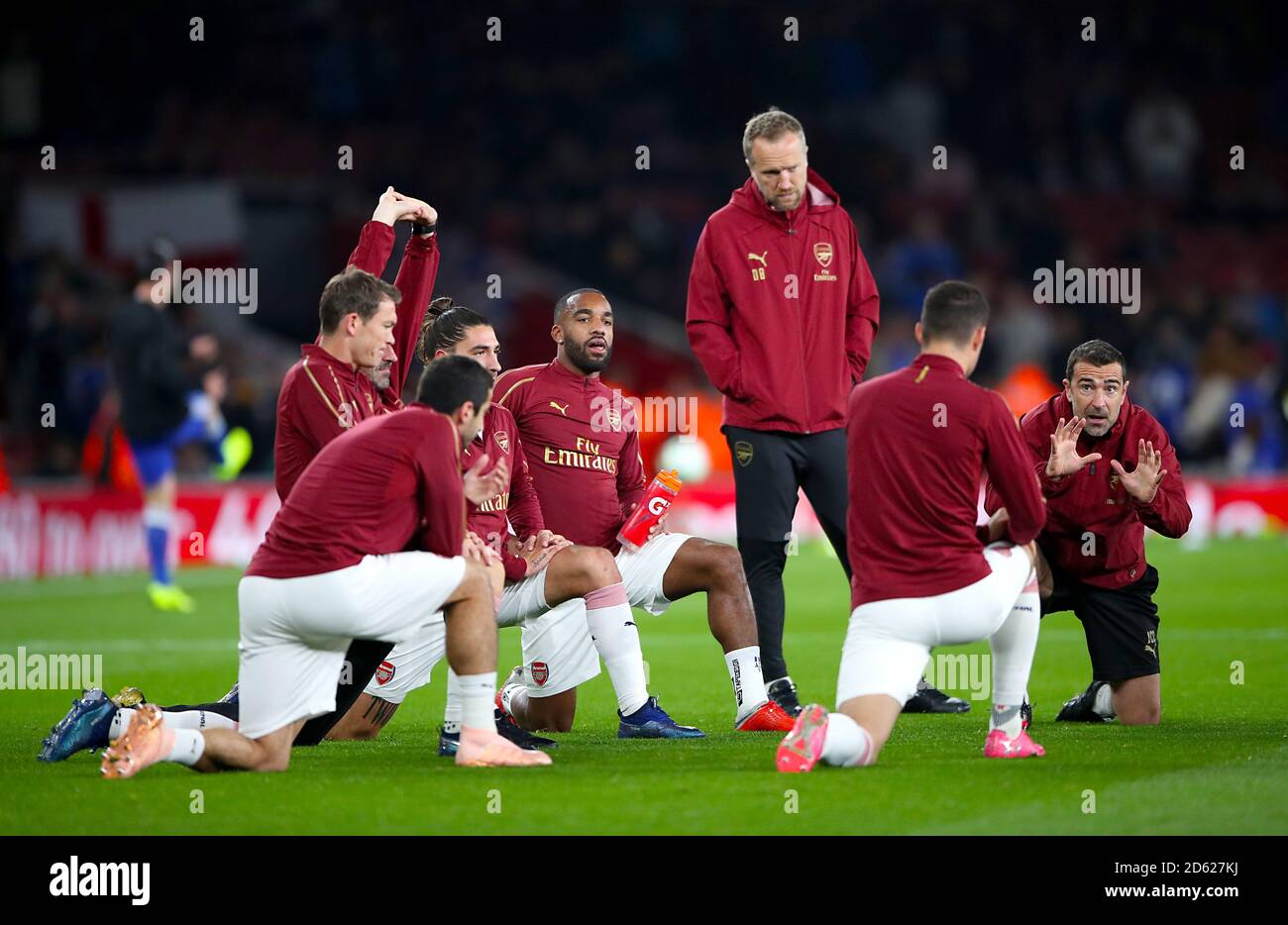 Arsenal First Team Assistant Head Coach Juan Carlos Carcedo (right) and Arsenal's Alexandre Lacazette (centre) during warm up  Stock Photo