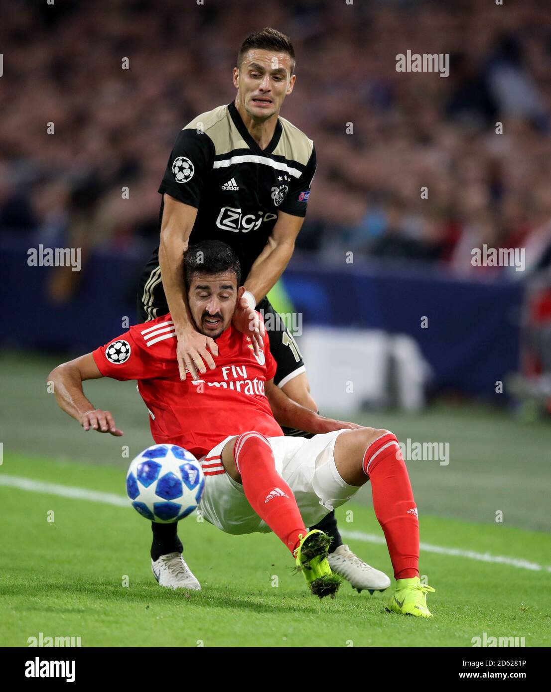 Ajax's Dusan Tadic (top) and Benfica's Andre Almeida battle for the ball Stock Photo