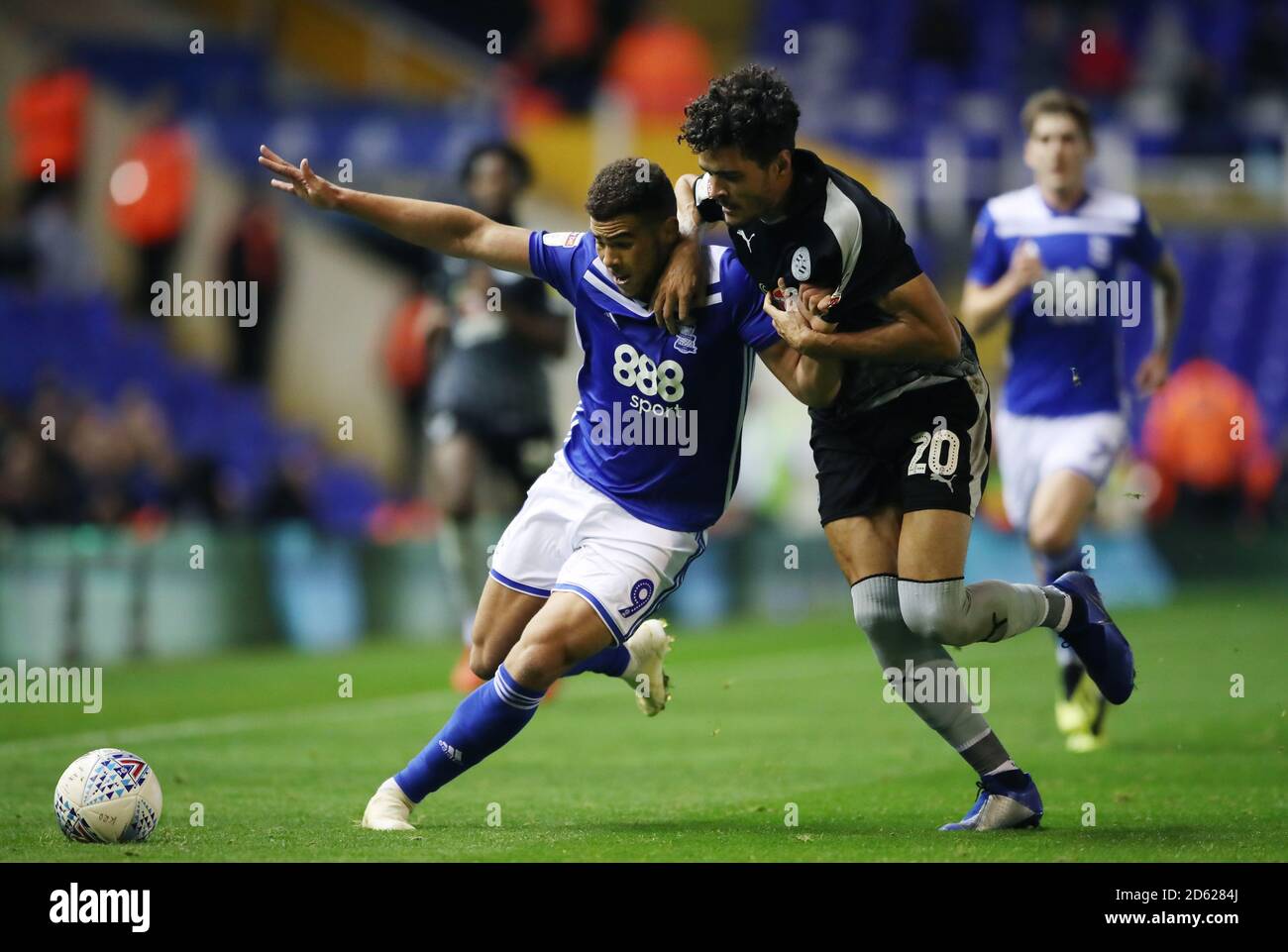 Birmingham City's Che Adams (left) battles to win ball with  Reading's Tiago Ilori Stock Photo
