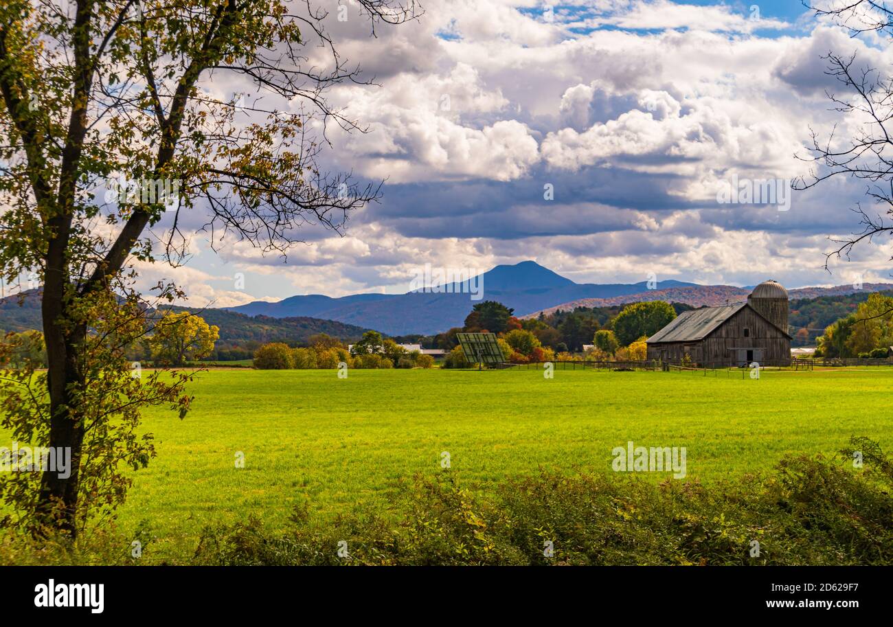 Vermont farm  with view of Camels Hump Mountain in fall foliage season Stock Photo