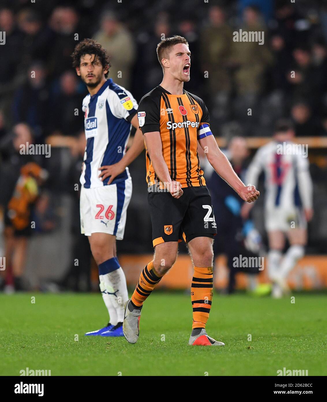 Hull City's Markus Henriksen celebrates as West Bromwich Albion's Ahmed Hegazy appears dejected in the background Stock Photo