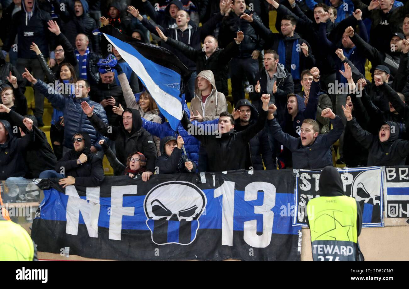 Club Brugge fans in the stands celebrate the result after the