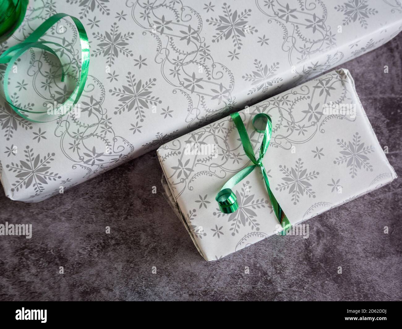 Gift packages wrapped for christmas Stock Photo - Alamy