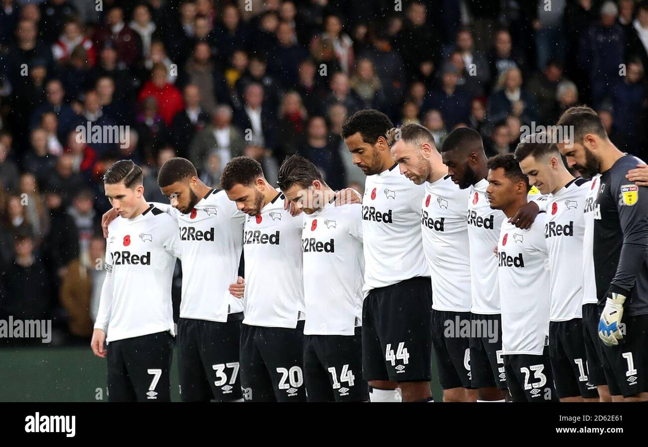 Derby County players observe a minute silence for Armistice Day