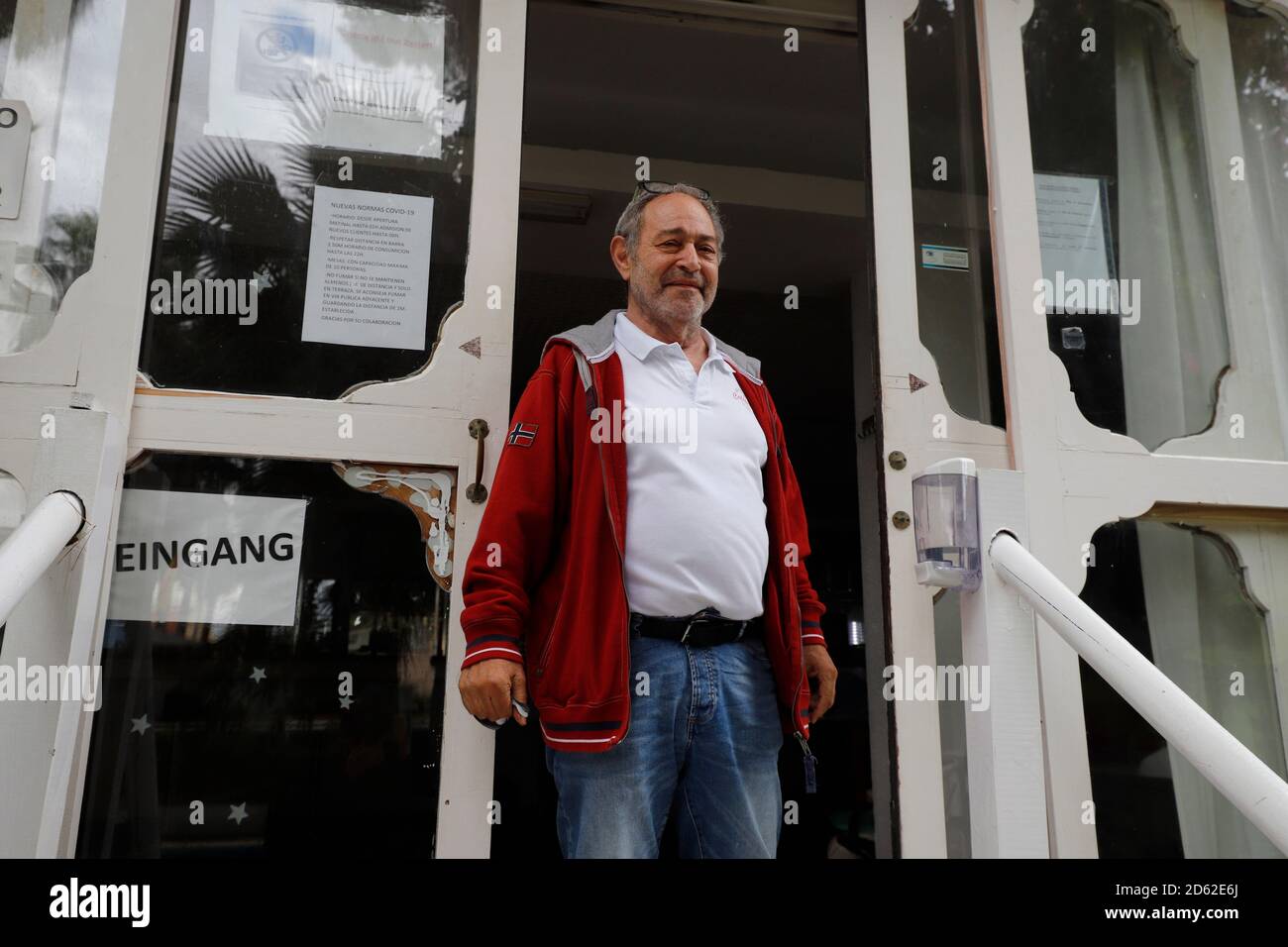 Palma, Spain. 14th Oct, 2020. Bernd Hartmann, director of the Hotel Alce on Arenal beach, stands for a photo at the entrance. The tourism industry on the island was severely affected by the Corona pandemic. Credit: Clara Margais/dpa/Alamy Live News Stock Photo