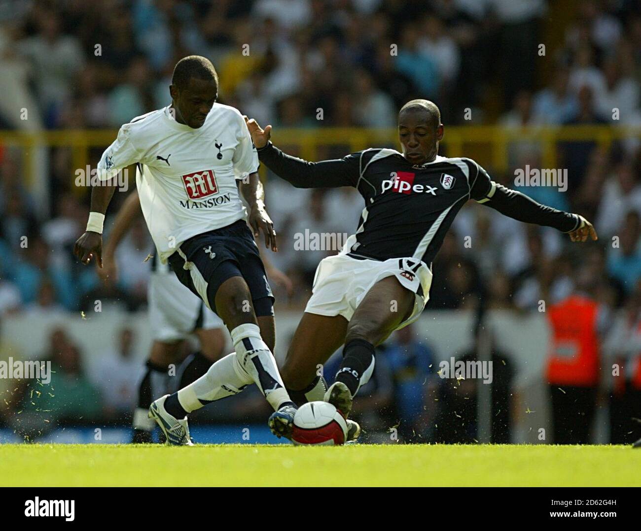 Tottenham Hotspur's Didier Zokora and Fulham's Luis Boa Morte battle for the ball Stock Photo