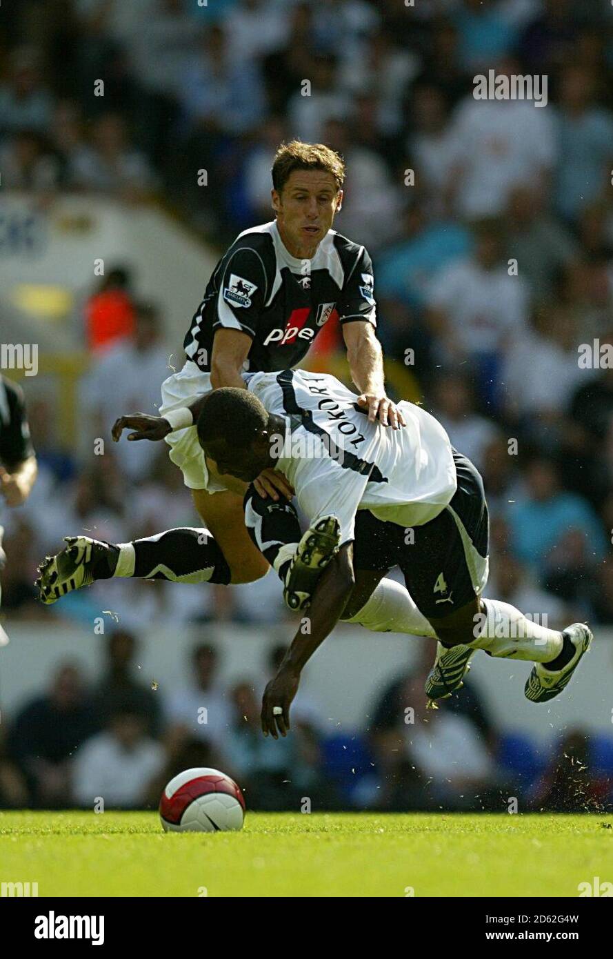 Tottenham Hotspur's Didier Zokora and Fulham's Michael Brown Stock Photo
