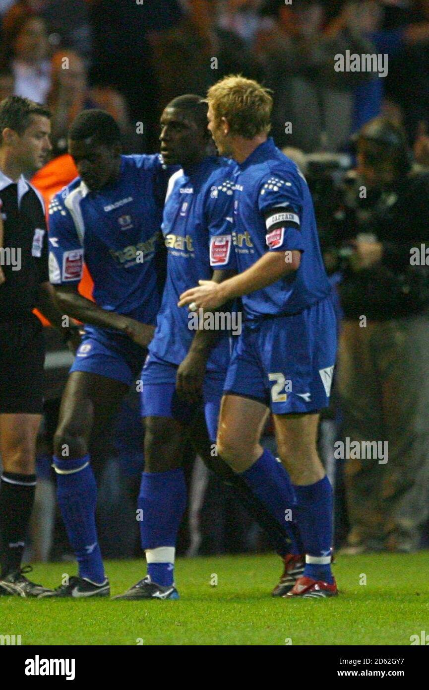 Peterborough United's Trevor Benjamin is congratulated by his team mates after scoring the equalising goal Stock Photo