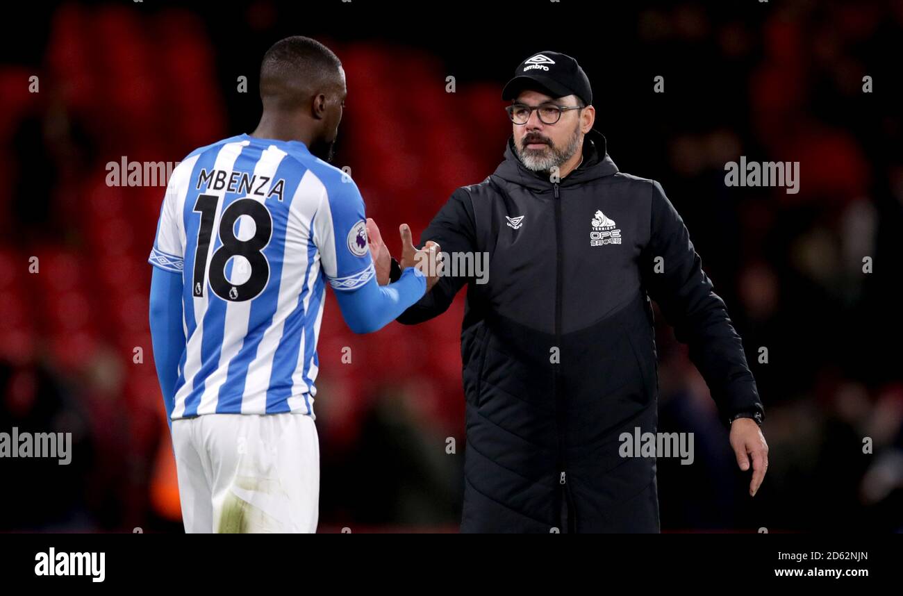 Huddersfield Town manager David Wagner shakes hands with Isaac Mbenza at the end of the match Stock Photo