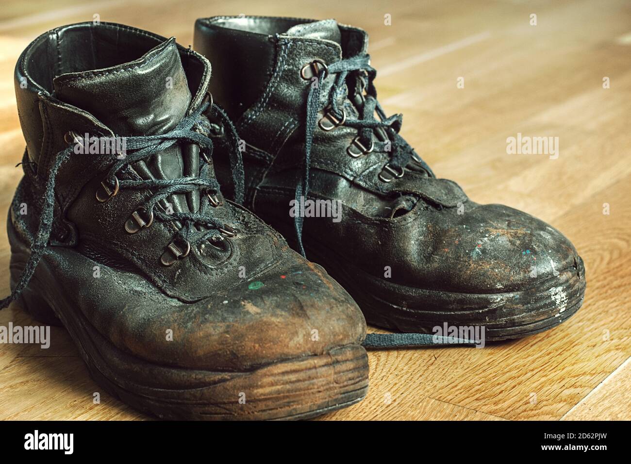 Black worn out old work boots hi-res stock photography and images - Alamy