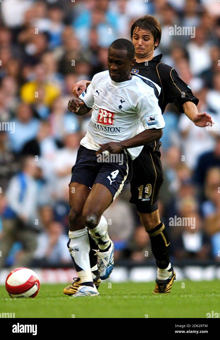 (R-L) Portsmouth's Niko Kranjcar and Tottenham Hotspur's Didier Zokora. Stock Photo