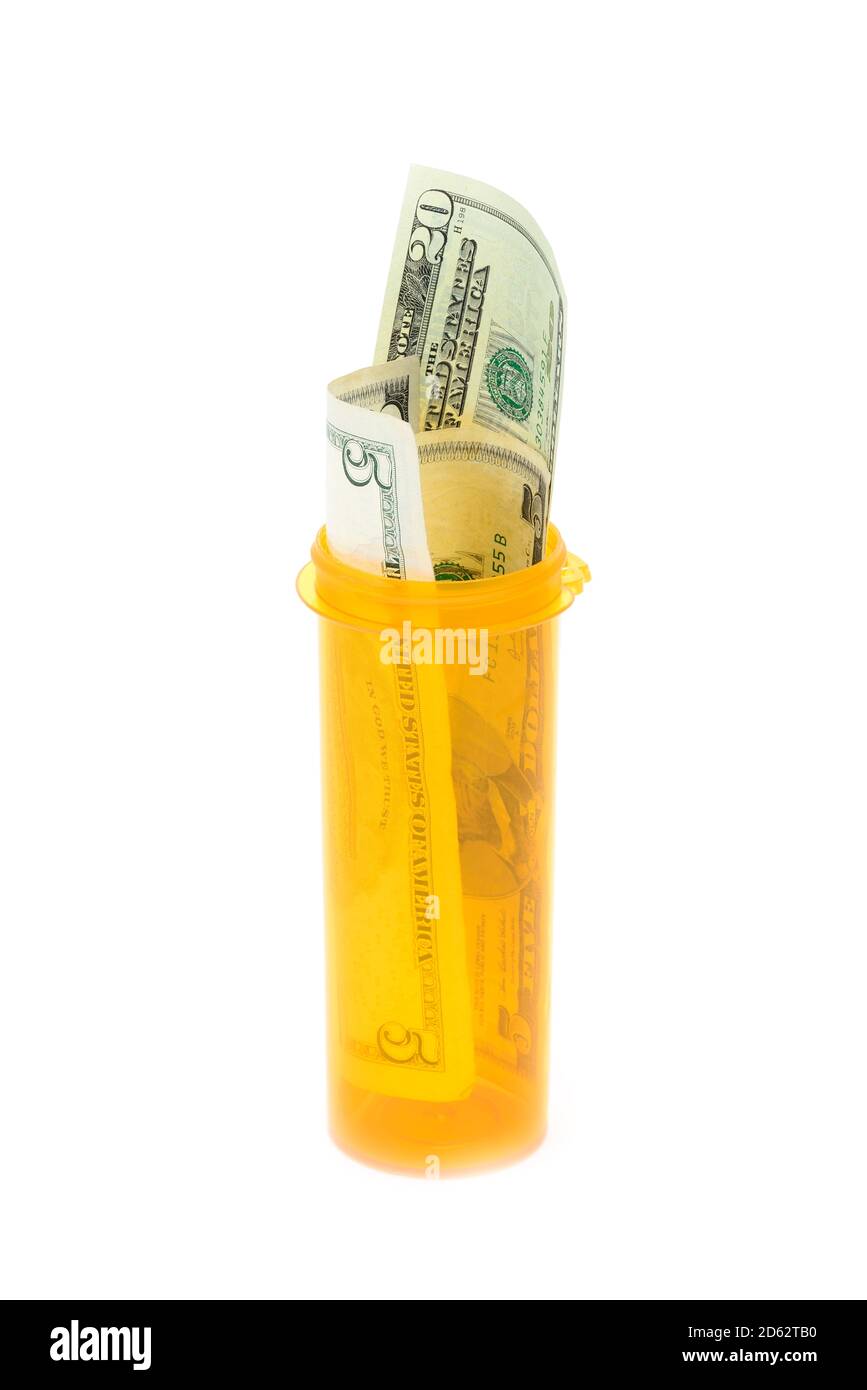 Bills in medicine bottle on a white background Stock Photo