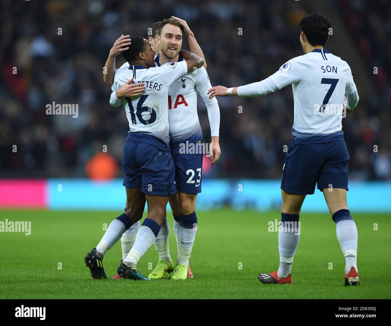 Tottenham Hotspur's Christian Eriksen celebrates scoring his side's first goal of the game with Kyle Walker-Peters (left) and Son Heung-min Stock Photo