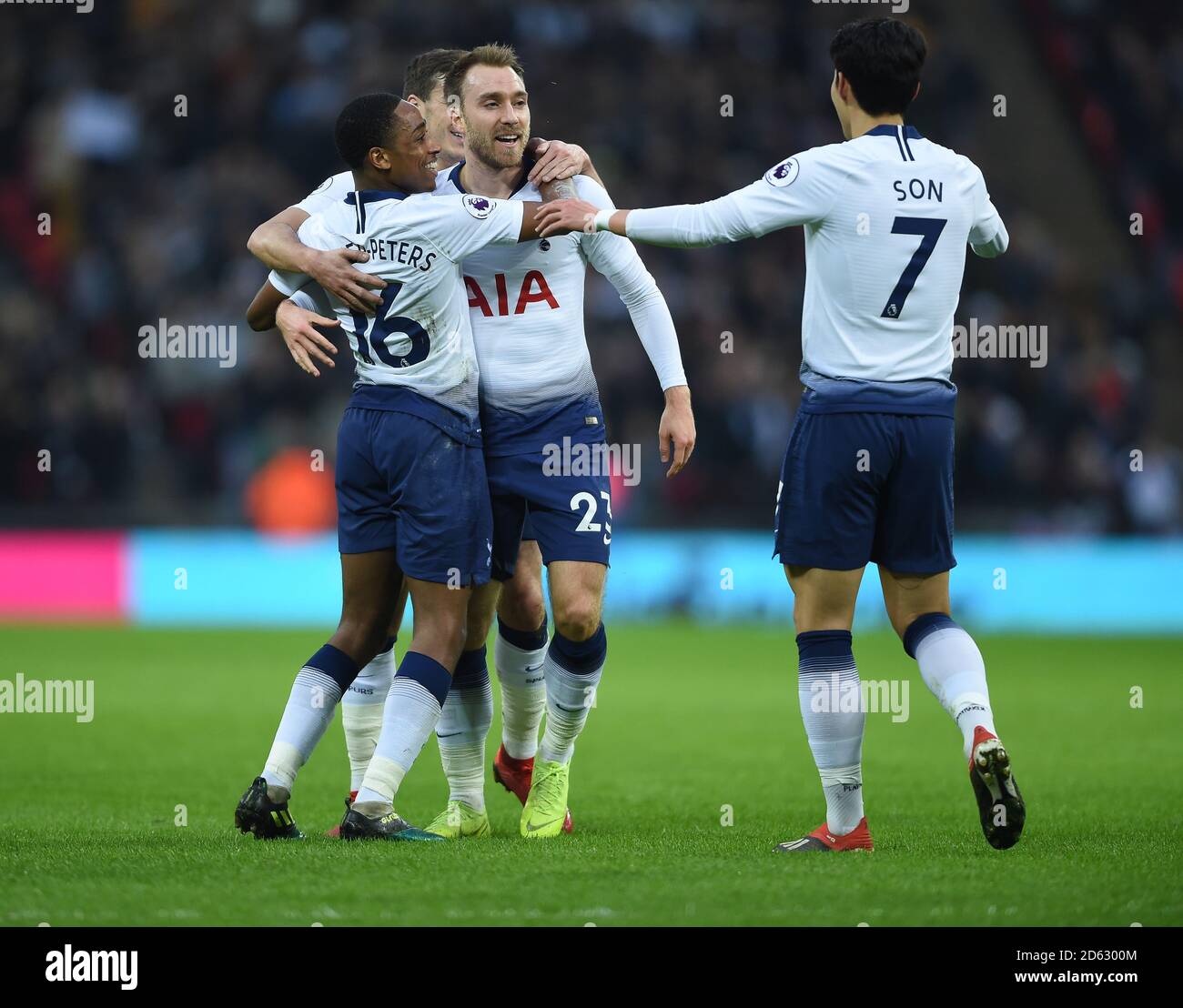 Tottenham Hotspur's Christian Eriksen celebrates scoring his side's first goal of the game with Kyle Walker-Peters (left) and Son Heung-min Stock Photo