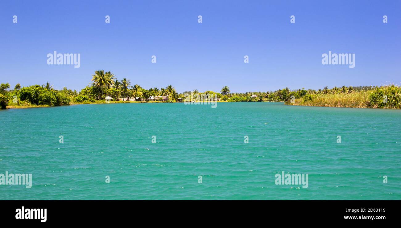 Tropical nature and Turqouis waters of  Manakara river and canal des pangalanes mixing with the ocean, Madagascar, African rivers Stock Photo