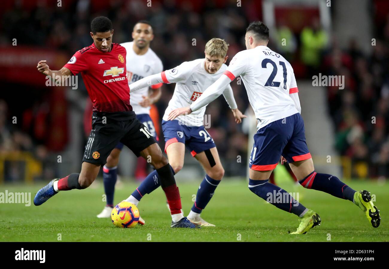 Manchester United's Marcus Rashford (left) battles for the ball with Bournemouth's David Brooks (centre) and Diego Rico Stock Photo