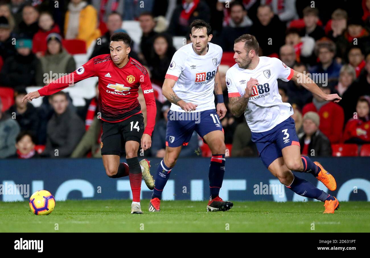 Manchester United's Jesse Lingard (left) battles for the ball with Bournemouth's Charlie Daniels (centre) and Steve Cook Stock Photo