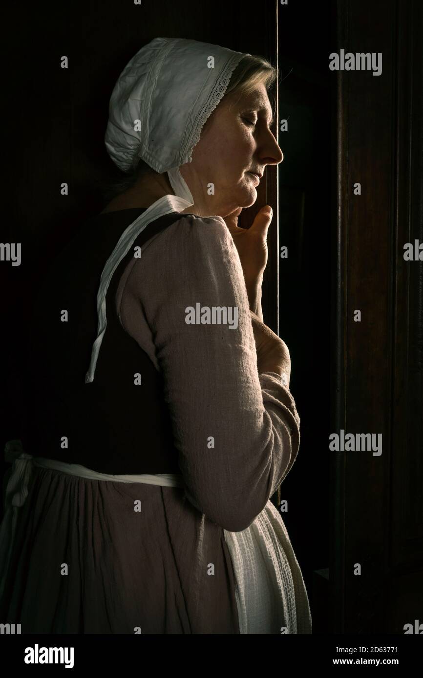 Hearing a secret at the door Stock Photo