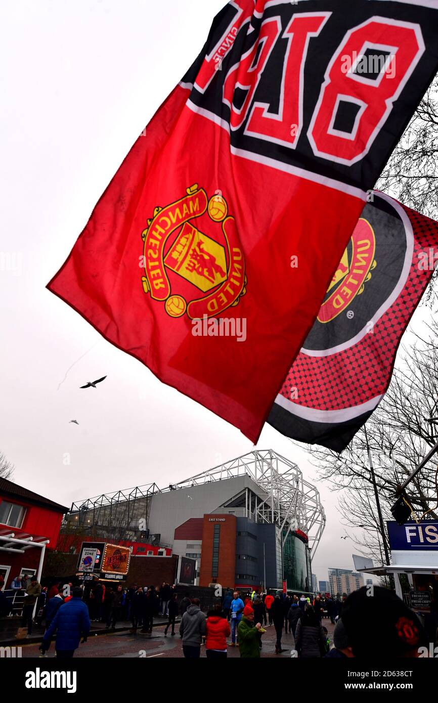 Fans and Manchester United flags outside the ground Stock Photo Alamy