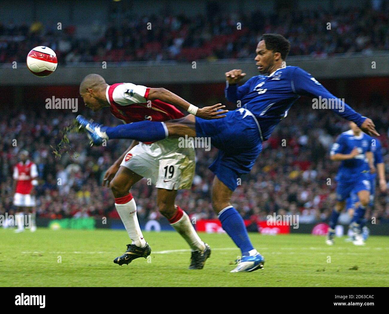 Arsenal's Gilberto Silva (l) is caught by a boot in the head by Everton's Joleon Lescott Stock Photo