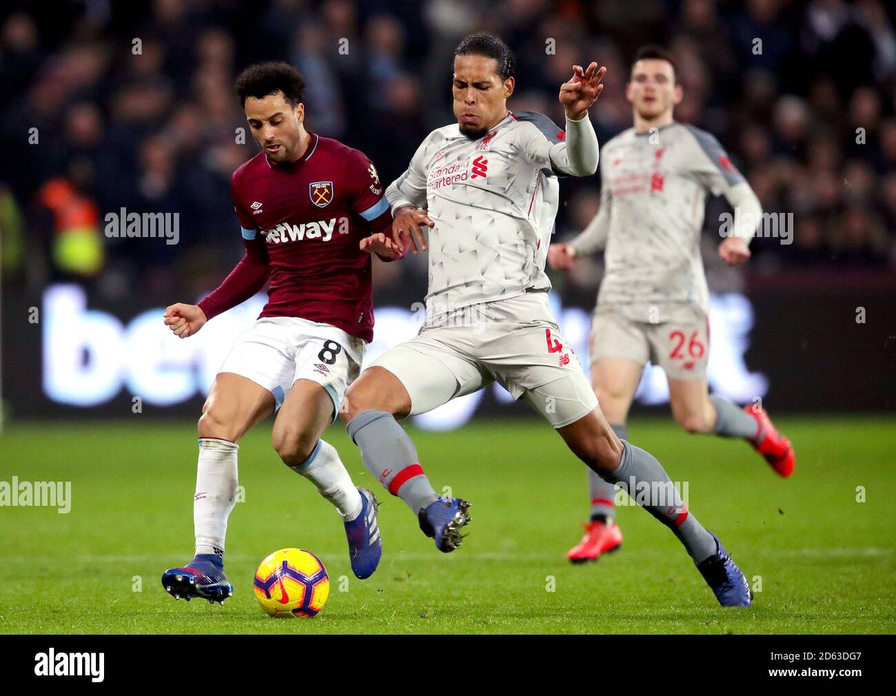 West Ham United's Felipe Anderson (left) and Liverpool's Virgil van Dijk (right) battle for the ball Stock Photo