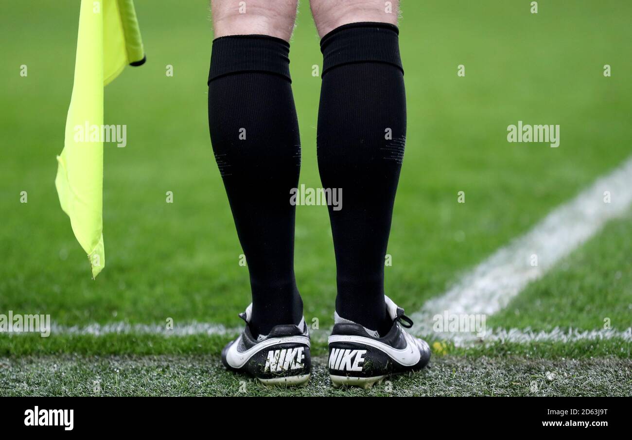 Detail of the assistant referee's boots Stock Photo - Alamy