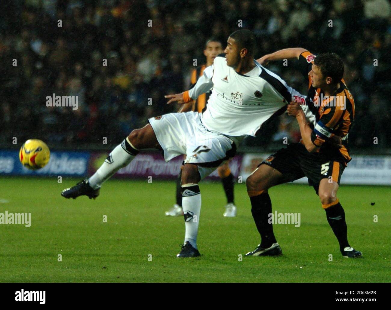 Hull's Danny Coles (right) and Wolverhampton's Leon Clarke tussle during  the Coca-Cola Championship match at the Kingston Communications Stadium,  Hull Stock Photo - Alamy