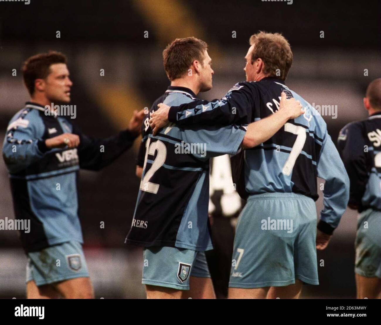Wycombe Wanderers' Dave Carroll is congratulated by his team mates after scoring the opening goal Stock Photo