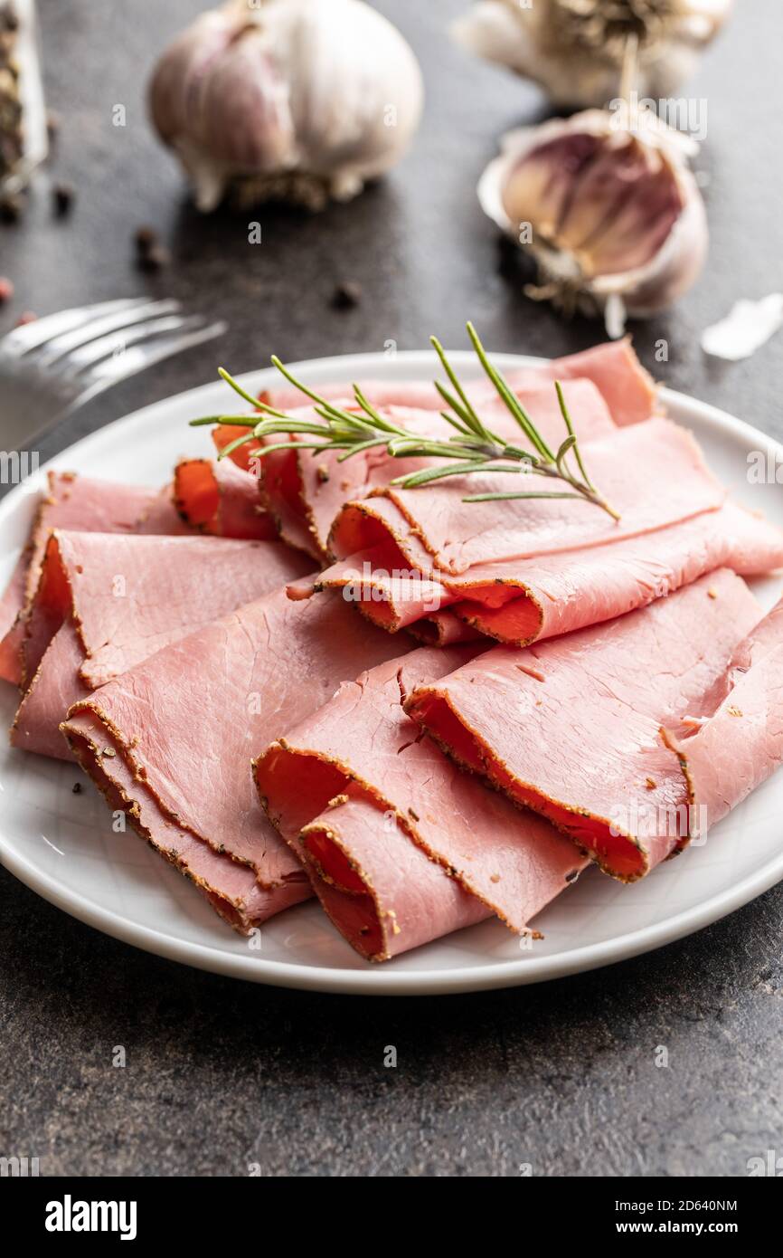 Sliced beef ham on plate Stock Photo Alamy