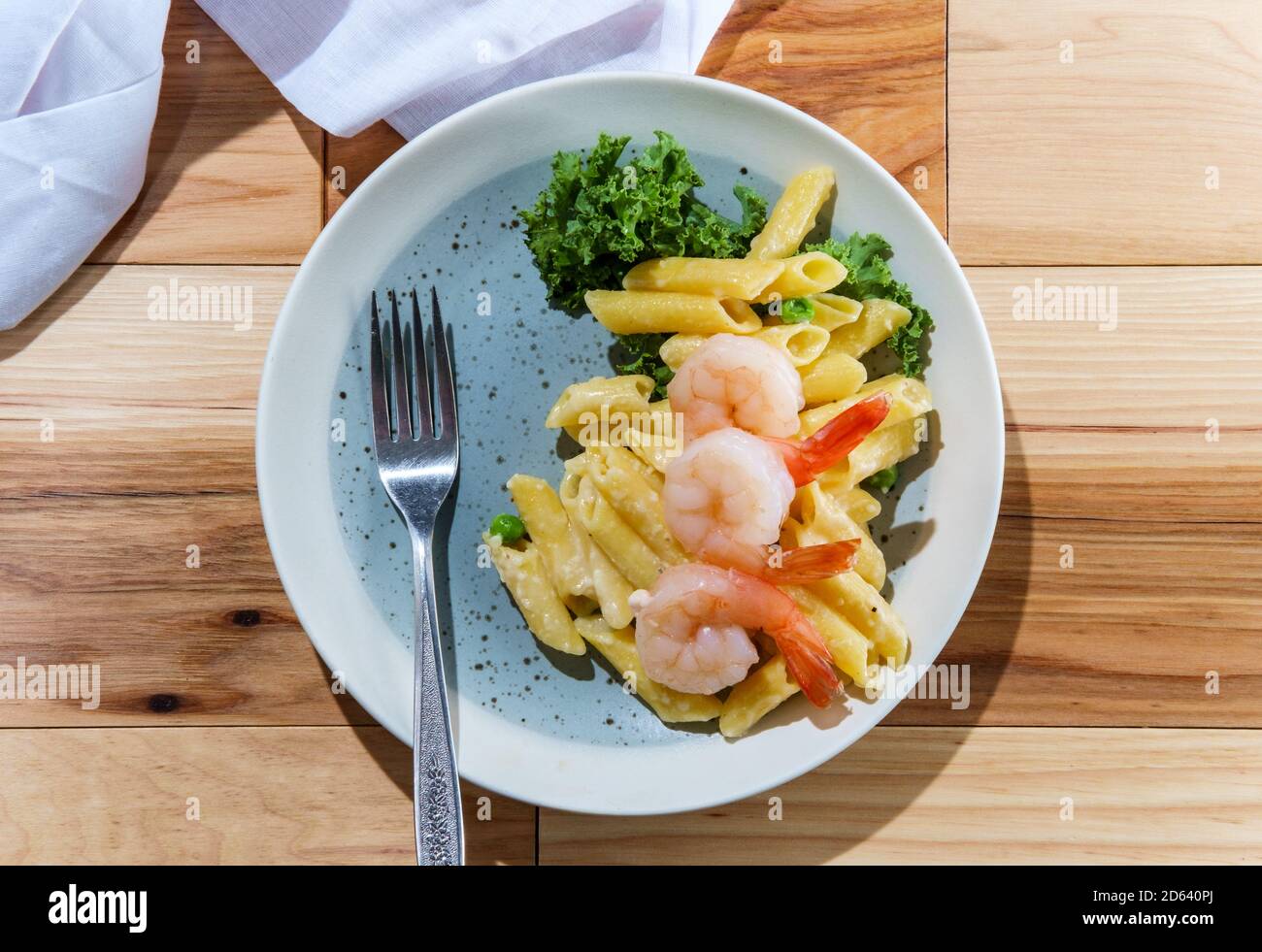 Italian penne pasta alfredo with tail-on steamed shrimp Stock Photo - Alamy