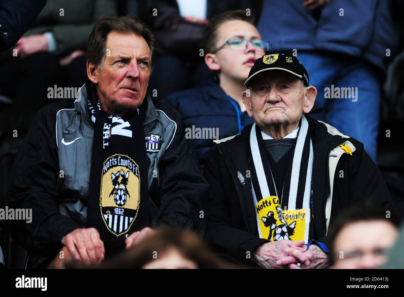 Notts County fans in the stands watch 