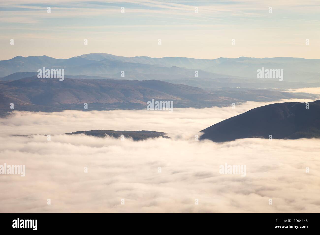 Hill raising above thick hi-res stock photography and images - Alamy