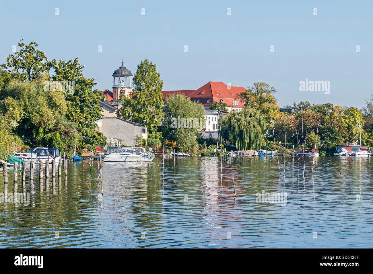 Potsdam, Germany -  September 30, 2020: Shore of the Tiefer See (Tiefer Lake) with the clock tower of the Oberstufenzentrum (Upper School Center) Joha Stock Photo