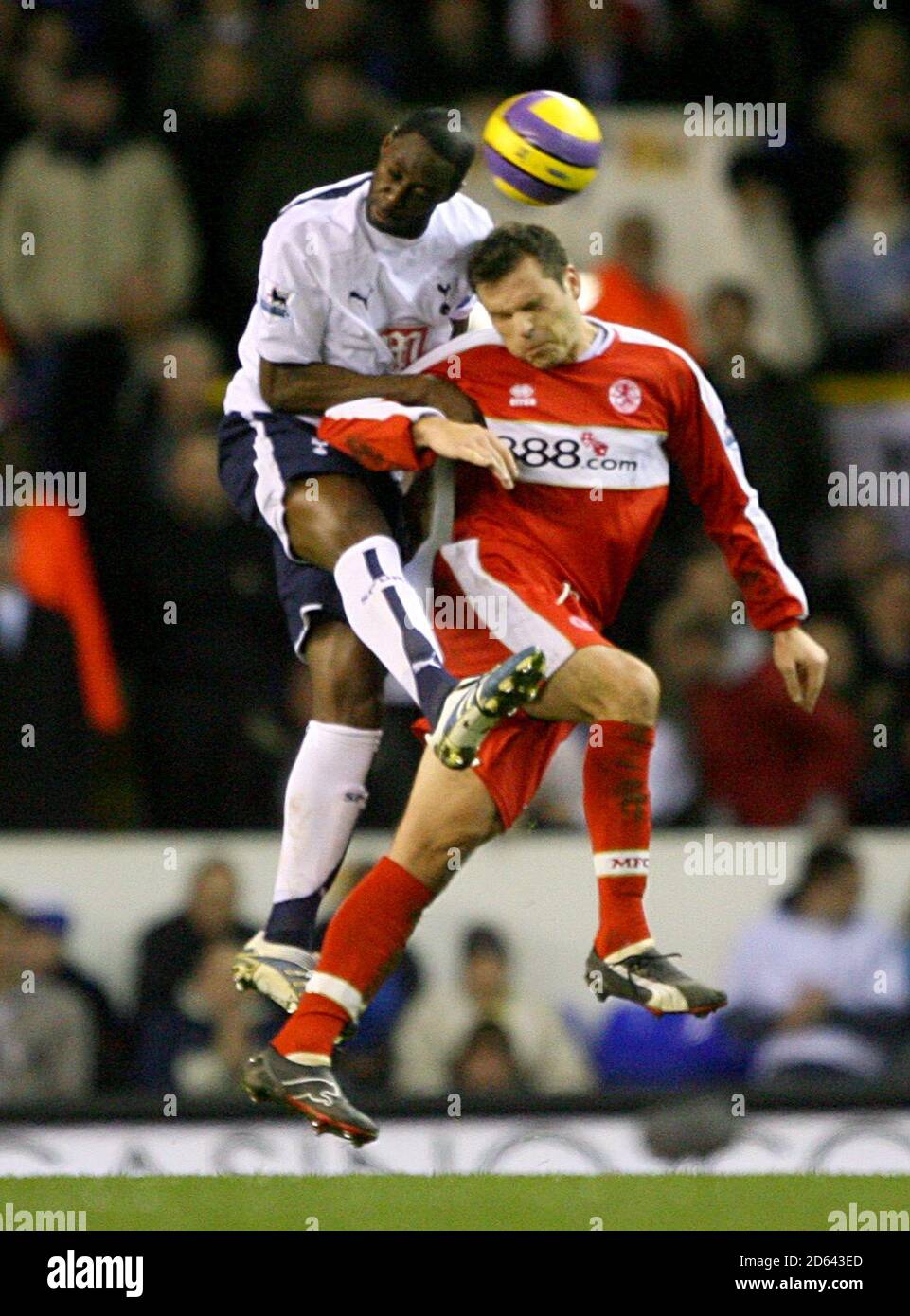 Tottenham's Ledley King and Middlesbrough's Mark Viduka challenge for the ball Stock Photo