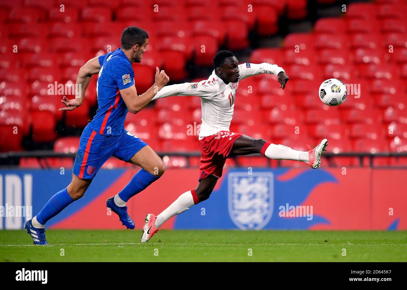 England's Conor Coady (left) and Denmark’s Pione Sisto during the UEFA Nations League Group 2, League A match at Wembley Stadium, London. Stock Photo