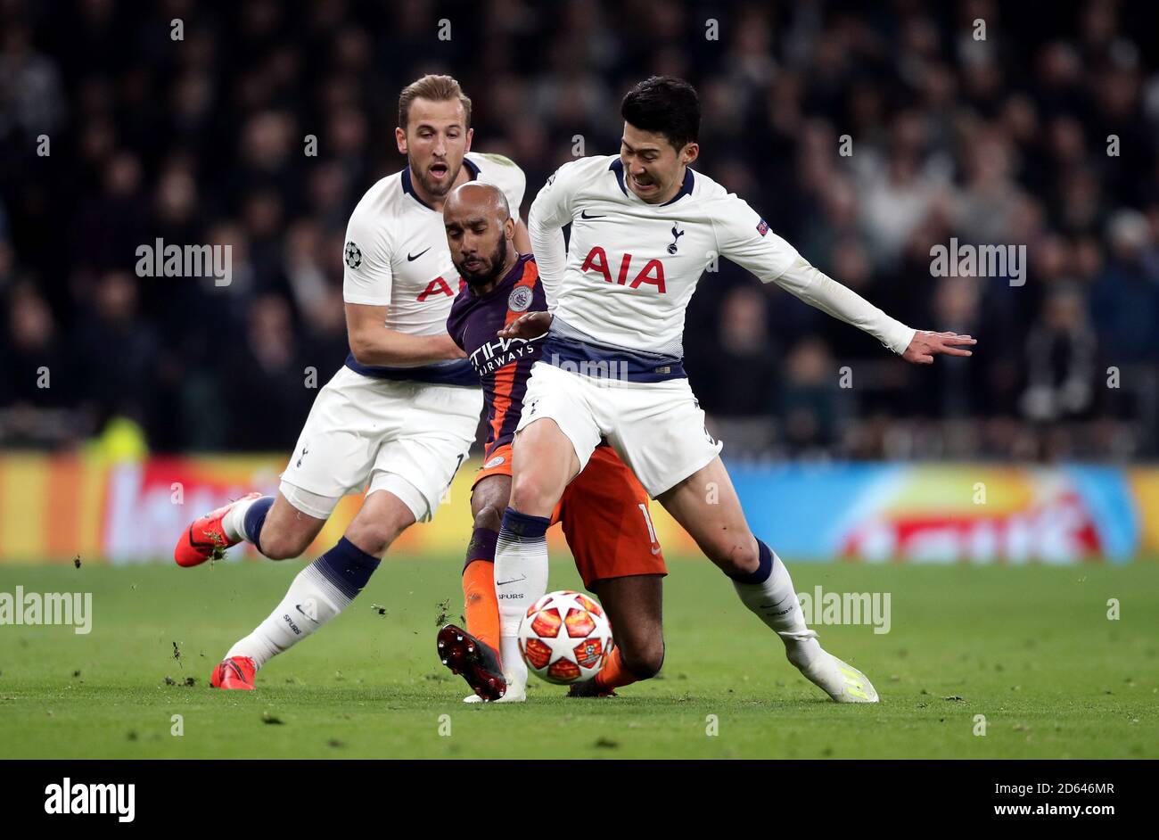 Manchester City's Fabian Delph battles for the ball with Tottenham Hotspur's Harry Kane (left) and Son Heung-min Stock Photo