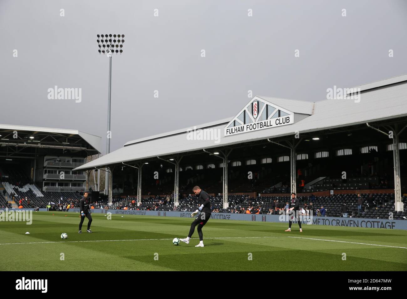 Everton players warm up at Craven Cottage ahead of Fulham and Everton's match Stock Photo