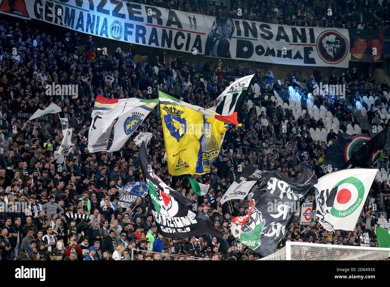 Juventus fans wave flags in the stands Stock Photo - Alamy