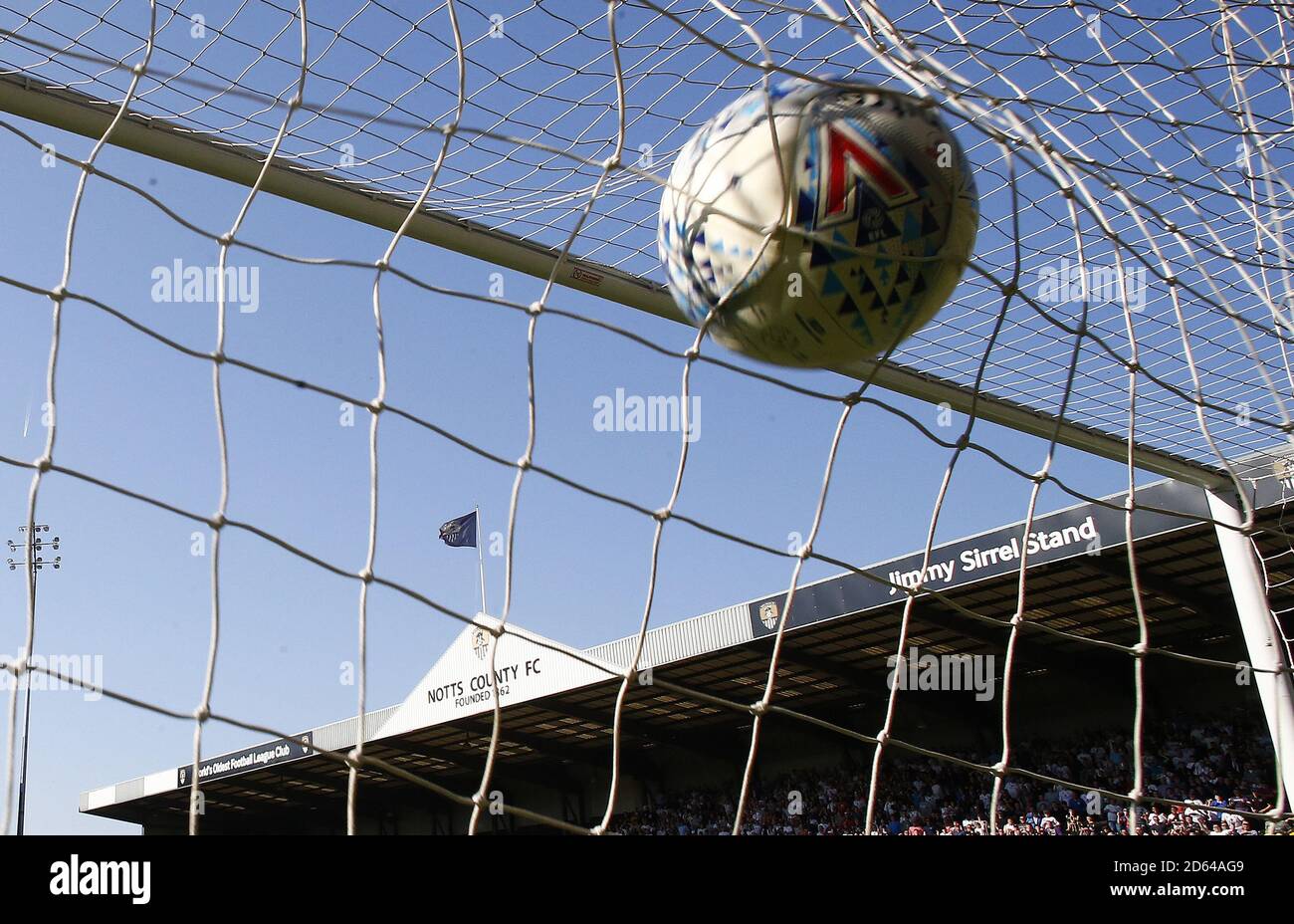 The ball hits the back of the net as Milton Keynes Dons' Chuks Aneke (not seen) scores his teams second goal of the game against Notts County Stock Photo